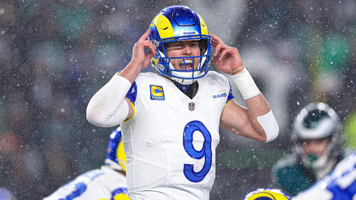 Jan 19, 2025; Philadelphia, Pennsylvania, USA; Los Angeles Rams quarterback Matthew Stafford (9) calls a play at the one of scrimmage against the Philadelphia Eagles in a 2025 NFC divisional round game at Lincoln Financial Field. Mandatory Credit: Bill Streicher-Imagn Images