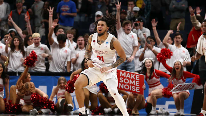 Mar 24, 2024; Memphis, TN, USA; Houston Cougars guard Emanuel Sharp (21) reacts after defeating the Texas A&M Aggies in over time in the second round of the 2024 NCAA Tournament at FedExForum. Mandatory Credit: Petre Thomas-Imagn Images