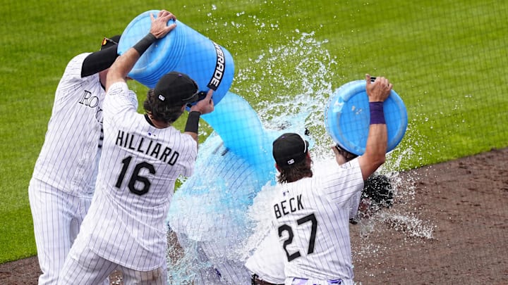 Colorado Rockies outfielders Brenton Doyle, Sam Hilliard and Jordan Beck celebrate a walk-off win against the San Francisco Giants.