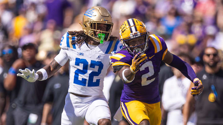 Sep 21, 2024; Baton Rouge, Louisiana, USA;  LSU Tigers wide receiver Kyren Lacy (2) misses a pass against UCLA Bruins defensive back Croix Stewart (22) during the first half at Tiger Stadium. Mandatory Credit: Stephen Lew-Imagn Images