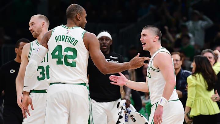 Apr 20, 2025; Boston, Massachusetts, USA; Boston Celtics guard Payton Pritchard (11) reacts with center Al Horford (42) after making a three point basket during the second half against the Orlando Magic at TD Garden. Mandatory Credit: Bob DeChiara-Imagn Images