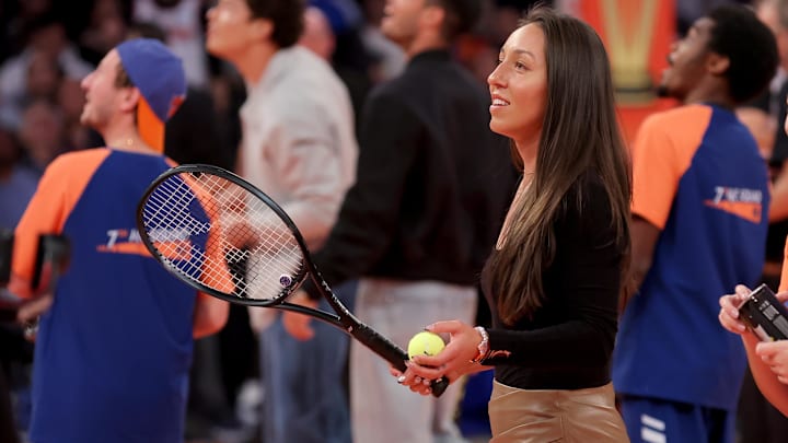Tennis star Jessica Pegula hits tennis balls into the stands during a time out during the third quarter between the New York Knicks and the Orlando Magic.