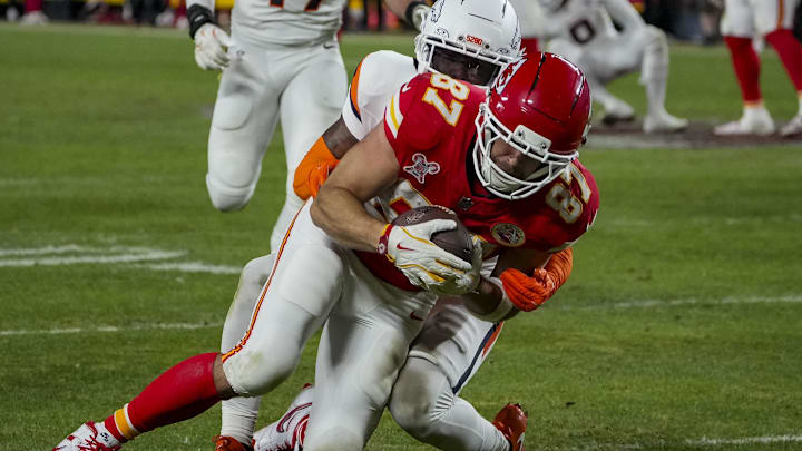 Dec 25, 2025; Kansas City, Missouri, USA; Kansas City Chiefs tight end Travis Kelce (87) runs the ball at GEHA Field at Arrowhead Stadium. 