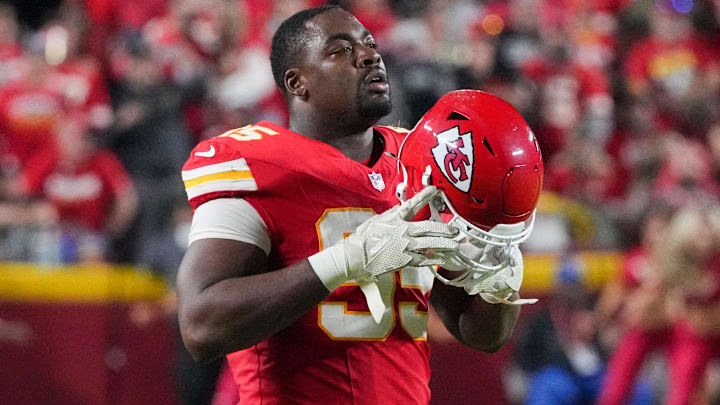 Kansas City Chiefs defensive tackle Chris Jones (95) removes his helmet during a timeout against the New Orleans Saints during the game at GEHA Field at Arrowhead Stadium.