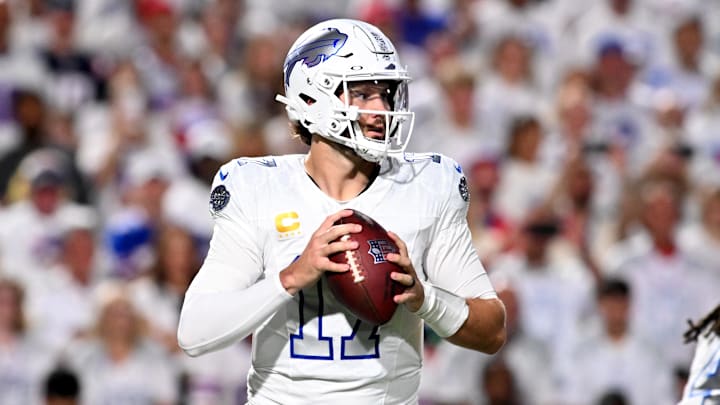 Buffalo Bills quarterback Josh Allen (17) drops back to pass against the New England Patriots during the first half at Highmark Stadium. 