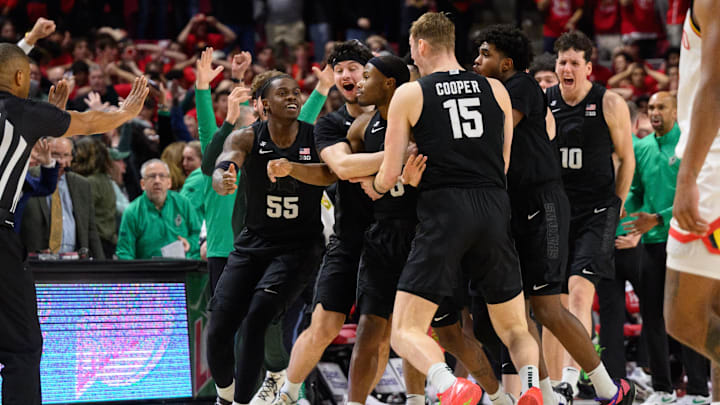 Feb 26, 2025; College Park, Maryland, USA; Michigan State Spartans guard Tre Holloman (5) celebrates with teammates after hitting a shot at the buzzer during the second half against the Maryland Terrapins at Xfinity Center. Mandatory Credit: Reggie Hildred-Imagn Images