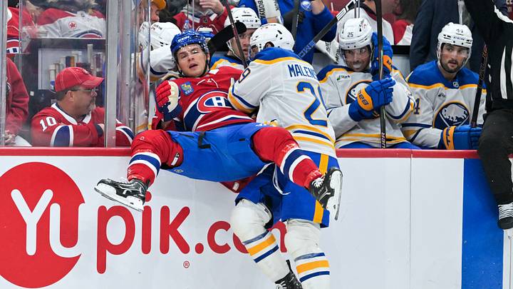Buffalo Sabres forward Beck Malenstyn (29) checks Montreal Canadiens forward Jake Evans (71) during the first period at the Bell Centre.  Mandatory Credit: Eric Bolte-Imagn Images