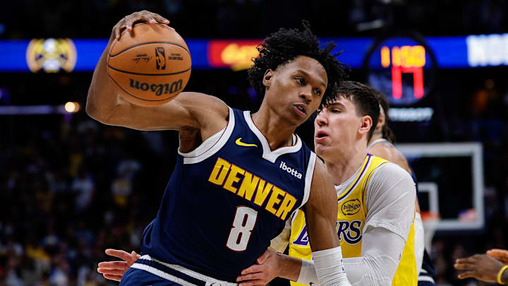Jan 20, 2026; Denver, Colorado, USA; Denver Nuggets guard Peyton Watson (8) controls the ball under pressure from Los Angeles Lakers forward Jake LaRavia (12) in the first quarter at Ball Arena. Mandatory Credit: Isaiah J. Downing-Imagn Images Jan 20, 2026; Denver, Colorado, USA; Denver Nuggets guard Peyton Watson (8) controls the ball under pressure from Los Angeles Lakers forward Jake LaRavia (12) in the first quarter at Ball Arena. Mandatory Credit: Isaiah J. Downing-Imagn Images
