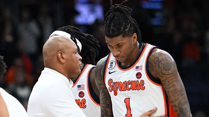 Feb 11, 2026; Syracuse, New York, USA; Syracuse Orange head coach Adrian Autry speaks to forward Donnie Freeman (1) during a first overtime period against the California Golden Bears at the JMA Wireless Dome. Mandatory Credit: Mark Konezny-Imagn Images