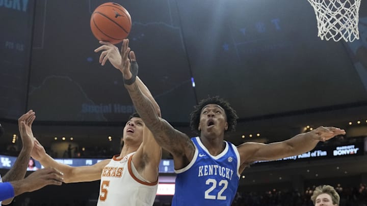 Feb 15, 2025; Austin, Texas, USA; Kentucky Wildcats center Amari Williams (22) and Texas Longhorns forward Kadin Shedrick (5) battle for the loose ball during the first half at Moody Center. Mandatory Credit: Scott Wachter-Imagn Images
