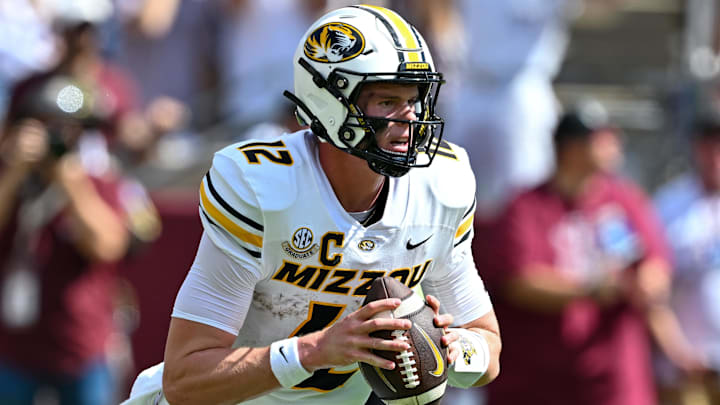 Oct 5, 2024; College Station, Texas, USA; Missouri Tigers quarterback Brady Cook (12) throws a pass in the first half against the Texas A&M Aggies at Kyle Field. Mandatory Credit: Maria Lysaker-Imagn Images. 