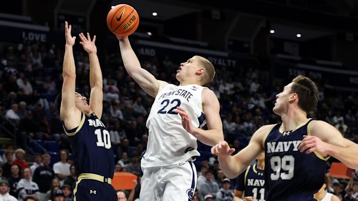 Nov 11, 2025; University Park, Pennsylvania, USA; Penn State Nittany Lions forward Sasa Ciani (22) drives the ball to the basket as Navy Midshipmen guard Jinwoo Kim (10) defends during the first half at Bryce Jordan Center. Mandatory Credit: Matthew O'Haren-Imagn Images