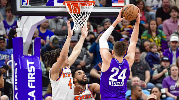 Nov 23, 2024; Salt Lake City, Utah, USA; Utah Jazz center Walker Kessler (24) take a shot over New York Knicks forward Pacome Dadiet (4) and center/forward Karl-Anthony Towns (32) during the first half at the Delta Center. Mandatory Credit: Christopher Creveling-Imagn Images Nov 23, 2024; Salt Lake City, Utah, USA; Utah Jazz center Walker Kessler (24) take a shot over New York Knicks forward Pacome Dadiet (4) and center/forward Karl-Anthony Towns (32) during the first half at the Delta Center. Mandatory Credit: Christopher Creveling-Imagn Images