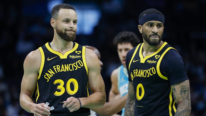 Mar 29, 2024; Charlotte, North Carolina, USA; Golden State Warriors guards Stephen Curry (30) and Gary Payton II look to the bench during a break in the action against the Charlotte Hornets during the first quarter at Spectrum Center. Mandatory Credit: Nell Redmond-Imagn Images