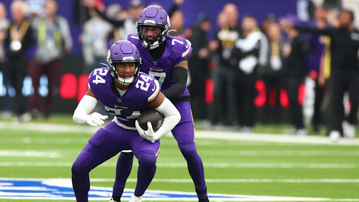 Oct 6, 2024; Tottenham, ENG; Minnesota Vikings Defensive Back Camryn Bynum (24) celebrates an interception in the 1st Quarter against New York Jets at Tottenham Hotspur Stadium. Mandatory Credit: Shaun Brooks-Imagn Images