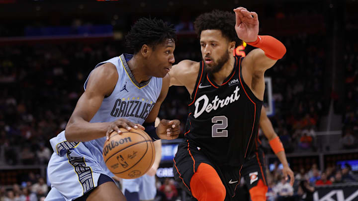 Apr 1, 2024; Detroit, Michigan, USA;  Memphis Grizzlies forward GG Jackson (45) dribbles defended by Detroit Pistons guard Cade Cunningham (2): Rick Osentoski-Imagn Images