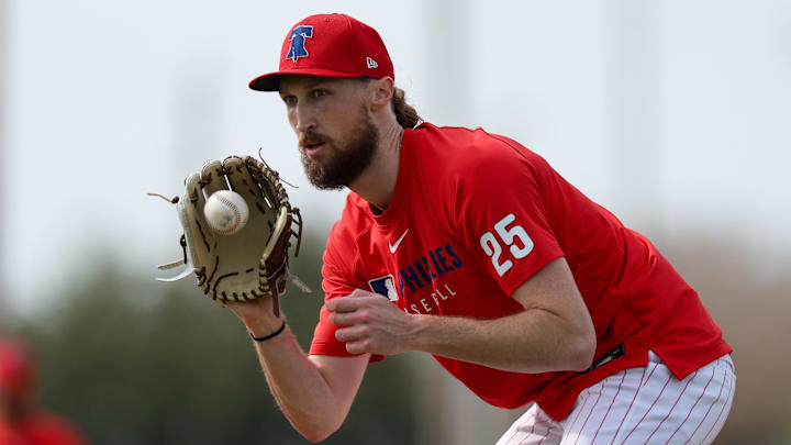 Feb 19, 2025; Clearwater, FL, USA; Philadelphia Phillies pitcher Matt Strahm (25) takes infield practice during spring training workouts at BayCare Ballpark.