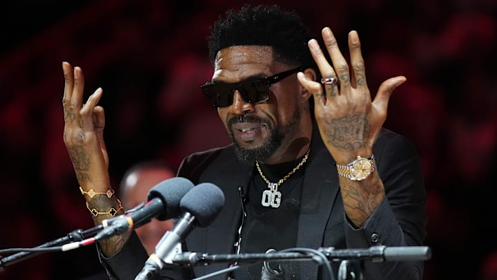 Jan 19, 2024; Miami, Florida, USA; Udonis Haslem speaks after his jersey was lifted to the rafters during the retirement ceremony during halftime of the game between the Miami Heat and the Atlanta Hawks Kaseya Center. Mandatory Credit: Jasen Vinlove-Imagn Images