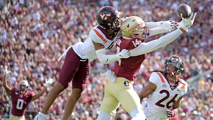 Oct 7, 2023; Tallahassee, Florida, USA; Florida State Seminoles wide receiver Keon Coleman (4) fails to secure a catch as Virginia Tech Hokies cornerback Mansoor Delane (4) defends during the first half at Doak S. Campbell Stadium. Mandatory Credit: Melina Myers-Imagn Images