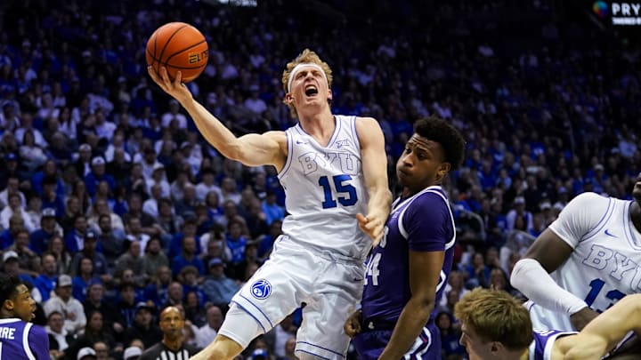 Jan 14, 2026; Provo, Utah, USA; BYU Cougars guard Richie Saunders (15) drives to the basket against the TCU Horned Frogs during the first half  at Marriott Center. Mandatory Credit: Aaron Baker-Imagn Images