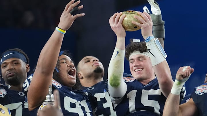 Penn State Nittany Lions teammates Drew Allar (15) and Dvon J-Thomas (91) celebrate their 31-14 win over the Boise State Broncos in the Fiesta Bowl. Penn State Nittany Lions teammates Drew Allar (15) and Dvon J-Thomas (91) celebrate their 31-14 win over the Boise State Broncos in the Fiesta Bowl.
