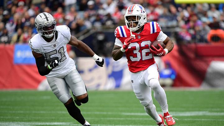 New England Patriots running back TreVeyon Henderson (32) runs the ball against Las Vegas Raiders defensive end Malcolm Koonce (51) during the second quarter at Gillette Stadium. New England Patriots running back TreVeyon Henderson (32) runs the ball against Las Vegas Raiders defensive end Malcolm Koonce (51) during the second quarter at Gillette Stadium.