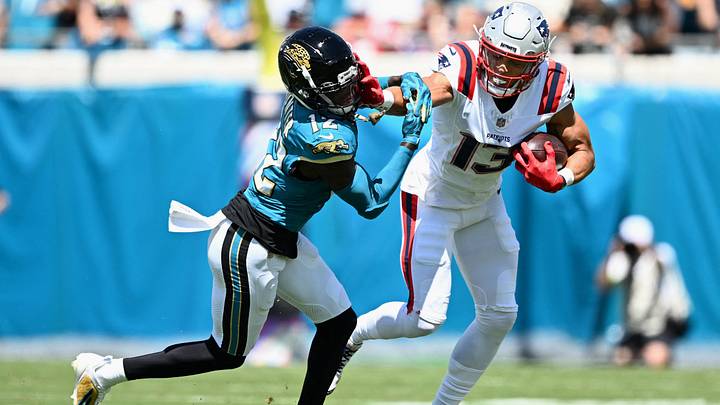 Sep 27, 2026; Jacksonville, Florida, USA; New England Patriots wide receiver Mack Hollins (13) runs for a gain past Jacksonville Jaguars wide receiver Travis Hunter (12) during the first quarter at EverBank Stadium. Mandatory Credit: Melina Myers-Imagn Images Sep 27, 2026; Jacksonville, Florida, USA; New England Patriots wide receiver Mack Hollins (13) runs for a gain past Jacksonville Jaguars wide receiver Travis Hunter (12) during the first quarter at EverBank Stadium. Mandatory Credit: Melina Myers-Imagn Images