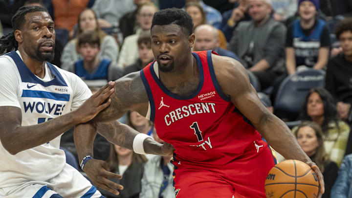 Mar 19, 2025; Minneapolis, Minnesota, USA; New Orleans Pelicans forward Zion Williamson (1) drives to the basket past Minnesota Timberwolves center Naz Reid (11) in the second half at Target Center. Mandatory Credit: Jesse Johnson-Imagn Images