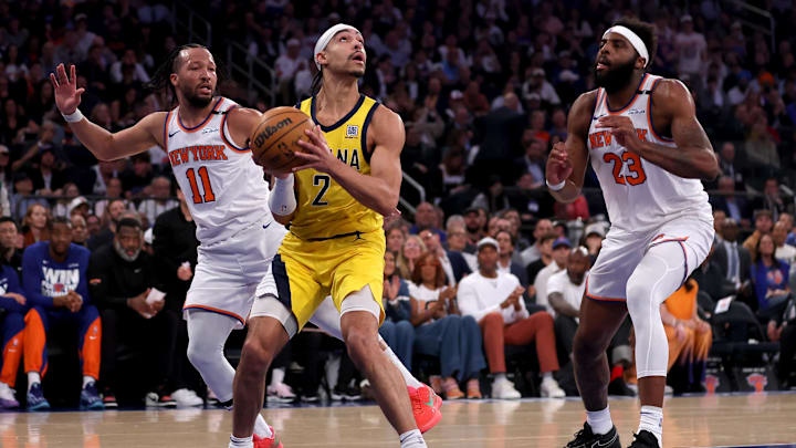 May 29, 2025; New York, New York, USA; Indiana Pacers guard Andrew Nembhard (2) looks to shoot the ball against New York Knicks guard Jalen Brunson (11) and center Mitchell Robinson (23) during the first quarter of game five of the eastern conference finals during the 2025 NBA Playoffs at Madison Square Garden. Mandatory Credit: Brad Penner-Imagn Images