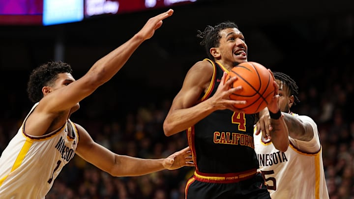 Jan 9, 2026; Minneapolis, Minnesota, USA; Southern California Trojans forward Chad Baker-Mazara (4) drives towards the basket as Minnesota Golden Gophers guard Isaac Asuma (1) defends during the second half at Williams Arena. Mandatory Credit: Matt Krohn-Imagn Images