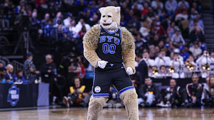 Mar 27, 2025; Newark, NJ, USA; Brigham Young Cougars mascot Cosmo the Cougar performs during an East Regional semifinal of the 2025 NCAA tournament against the Alabama Crimson Tide at Prudential Center. Mandatory Credit: Vincent Carchietta-Imagn Images