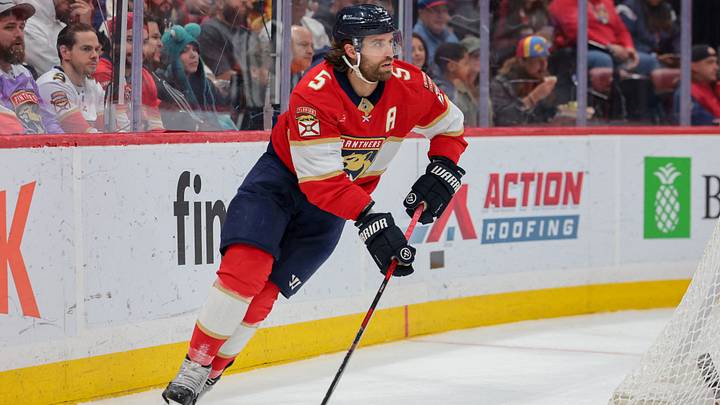 Mar 24, 2026; Sunrise, Florida, USA; Florida Panthers defenseman Aaron Ekblad (5) moves the puck against the Seattle Kraken during the second period at Amerant Bank Arena. Mandatory Credit: Sam Navarro-Imagn Images