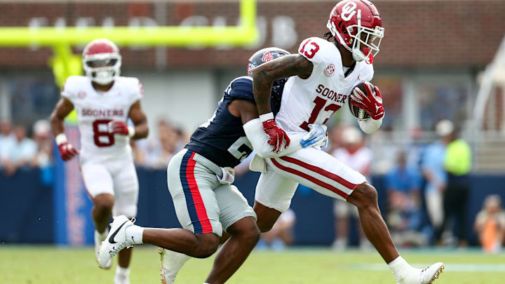 Oklahoma Sooners wide receiver J.J. Hester runs after a catch against Ole Miss. Oklahoma Sooners wide receiver J.J. Hester runs after a catch against Ole Miss.
