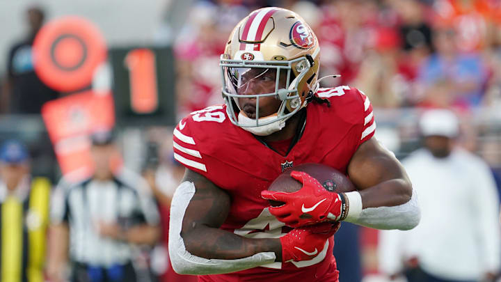Aug 9, 2025; Santa Clara, California, USA;  San Francisco 49ers running back Corey Kiner (49) runs the ball in the second quarter against Denver Broncos at Levi's Stadium. Mandatory Credit: David Gonzales-Imagn Images