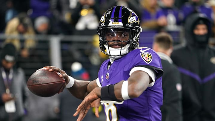 Jan 11, 2025; Baltimore, Maryland, USA; Baltimore Ravens quarterback Lamar Jackson (8) warms up before an AFC wild card game against the Pittsburgh Steelers at M&T Bank Stadium. Mandatory Credit: Mitch Stringer-Imagn Images