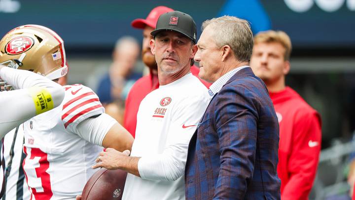 Sep 7, 2025; Seattle, Washington, USA; San Francisco 49ers general manager John Lynch, right, talks with head coach Kyle Shanahan during pregame warmups against the Seattle Seahawks at Lumen Field. Mandatory Credit: Joe Nicholson-Imagn Images