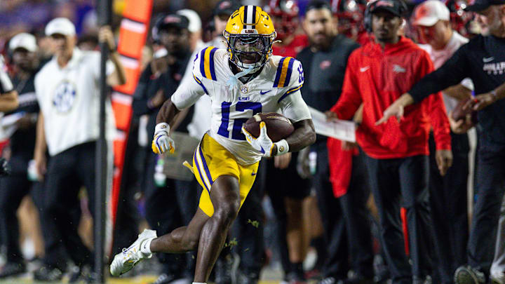 Nov 22, 2025; Baton Rouge, Louisiana, USA;  LSU Tigers wide receiver Kyle Parker (12) runs against the Western Kentucky Hilltoppers during the first half at Tiger Stadium. Mandatory Credit: Stephen Lew-Imagn Images