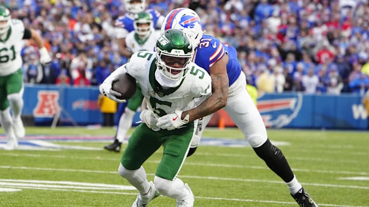 Dec 29, 2024; Orchard Park, New York, USA; Buffalo Bills cornerback Rasul Douglas (31) tackles New York Jets wide receiver Garrett Wilson (5) during the first half at Highmark Stadium. Mandatory Credit: Gregory Fisher-Imagn Images Dec 29, 2024; Orchard Park, New York, USA; Buffalo Bills cornerback Rasul Douglas (31) tackles New York Jets wide receiver Garrett Wilson (5) during the first half at Highmark Stadium. Mandatory Credit: Gregory Fisher-Imagn Images