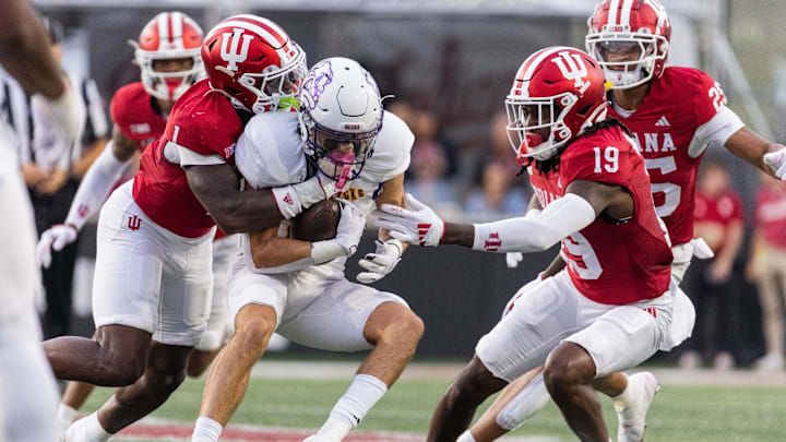Western Illinois Leathernecks wide receiver Demari Davis (3) catches the ball while Indiana Hoosiers defensive back Shawn Asbury II (1) defends in the first quarter at Memorial Stadium.