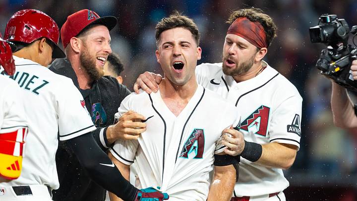 Aug 25, 2026; Phoenix, Arizona, USA; Arizona Diamondbacks pinch hitter Ryan Waldschmidt (right) celebrates with teammates Merrill Kelly and Tim Tawa after hitting a two run walk off home run in the ninth inning against the Chicago Cubs at Chase Field. Mandatory Credit: Mark J. Rebilas-Imagn Images