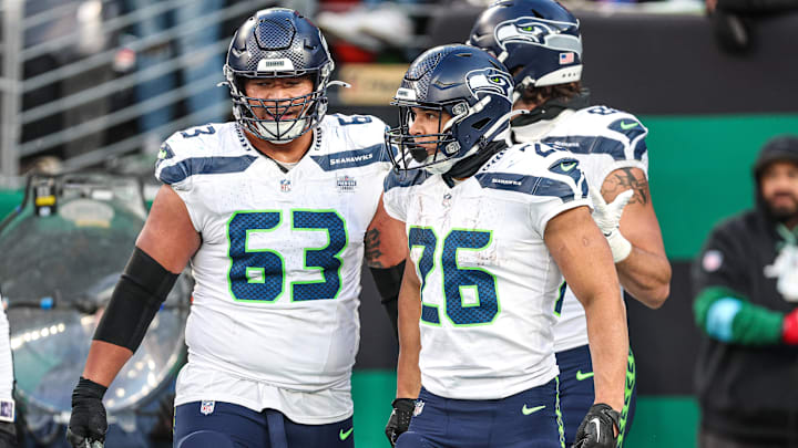 Dec 1, 2024; East Rutherford, New Jersey, USA; Seattle Seahawks running back Zach Charbonnet (26) celebrates his touchdown with teammates during the second half against the Seattle Seahawks at MetLife Stadium. Mandatory Credit: Vincent Carchietta-Imagn Images Dec 1, 2024; East Rutherford, New Jersey, USA; Seattle Seahawks running back Zach Charbonnet (26) celebrates his touchdown with teammates during the second half against the Seattle Seahawks at MetLife Stadium. Mandatory Credit: Vincent Carchietta-Imagn Images