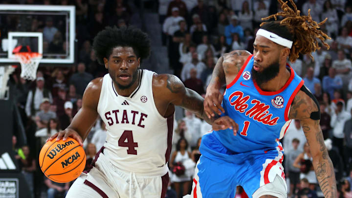 Jan 18, 2025; Starkville, Mississippi, USA; Mississippi State Bulldogs forward Cameron Matthews (4) drives to the basket as Mississippi Rebels forward Mikeal Brown-Jones (1) defends during over-time at Humphrey Coliseum. Mandatory Credit: Petre Thomas-Imagn Images Jan 18, 2025; Starkville, Mississippi, USA; Mississippi State Bulldogs forward Cameron Matthews (4) drives to the basket as Mississippi Rebels forward Mikeal Brown-Jones (1) defends during over-time at Humphrey Coliseum. Mandatory Credit: Petre Thomas-Imagn Images