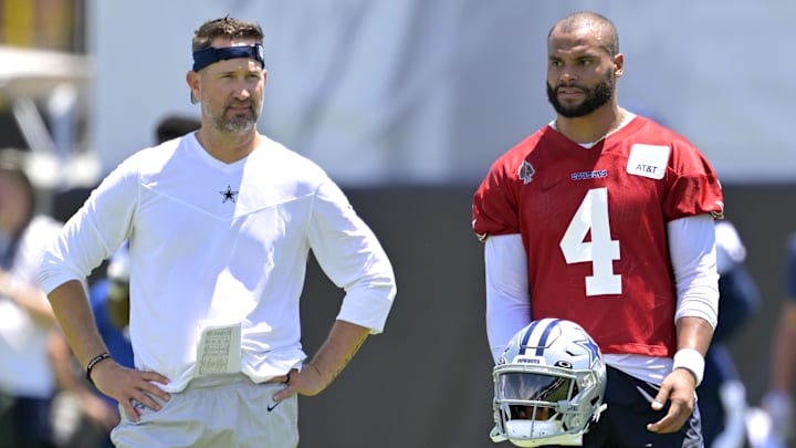 Dallas Cowboys quarterback Dak Prescott talks with offensive coordinator Brian Schottenheimer during training camp at River Ridge Playing Fields in Oxnard, CA. Dallas Cowboys quarterback Dak Prescott talks with offensive coordinator Brian Schottenheimer during training camp at River Ridge Playing Fields in Oxnard, CA.
