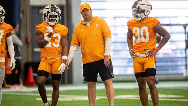Tennessee head coach Josh Heupel with defensive backs Boo Carter (23) and Jakobe Thomas (30) during