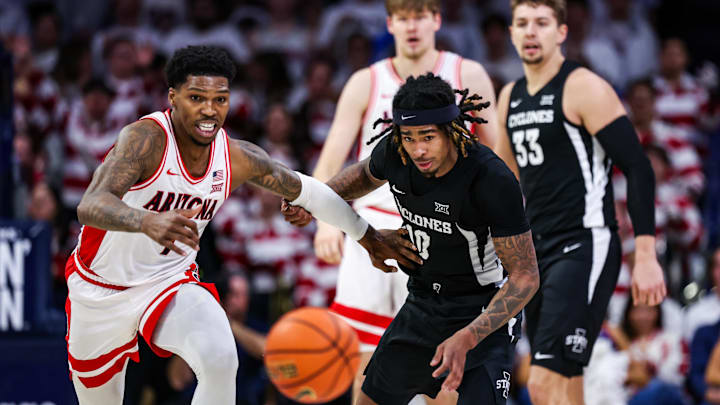 Jan 27, 2025; Tucson, Arizona, USA; Arizona Wildcats guard Caleb Love (1) and Iowa State Cyclones guard Keshon Gilbert (10) run toward the ball during the second half at McKale Center. Mandatory Credit: Aryanna Frank-Imagn Images