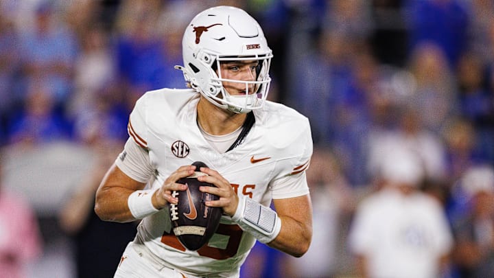 Texas Longhorns quarterback Arch Manning (16) looks for an open receiver during the first quarter against the Kentucky Wildcats at Kroger Field. Texas Longhorns quarterback Arch Manning (16) looks for an open receiver during the first quarter against the Kentucky Wildcats at Kroger Field.