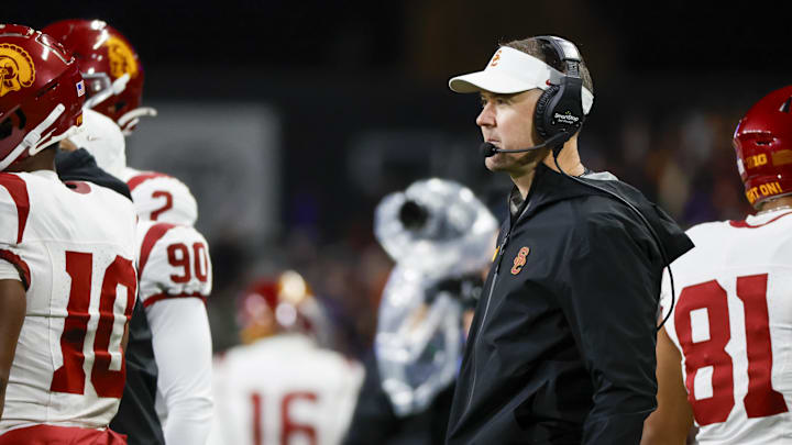 Nov 2, 2024; Seattle, Washington, USA; USC Trojans head coach Lincoln Riley stands on the sideline during the fourth quarter against the Washington Huskies at Alaska Airlines Field at Husky Stadium. Mandatory Credit: Joe Nicholson-Imagn Images Nov 2, 2024; Seattle, Washington, USA; USC Trojans head coach Lincoln Riley stands on the sideline during the fourth quarter against the Washington Huskies at Alaska Airlines Field at Husky Stadium. Mandatory Credit: Joe Nicholson-Imagn Images