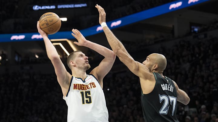 Apr 30, 2026; Minneapolis, Minnesota, USA; Denver Nuggets center Nikola Jokic (15) shoots the ball over Minnesota Timberwolves center Rudy Gobert (27) in the second half during game six of the first round of the 2026 NBA Playoffs at Target Center. Mandatory Credit: Jesse Johnson-Imagn Images