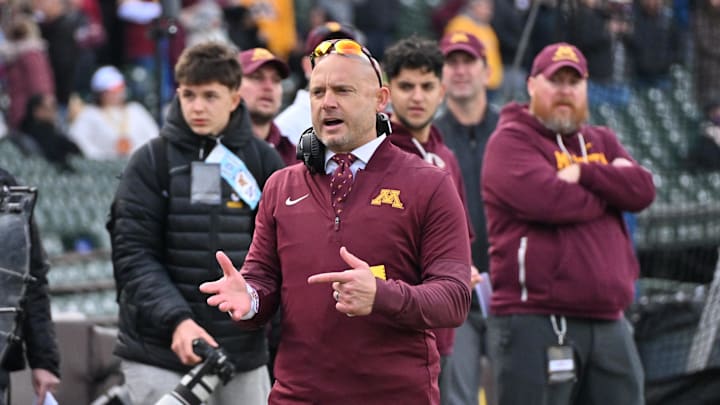 Nov 22, 2025; Chicago, Illinois, USA; Minnesota Golden Gophers head coach P.J. Fleck directs his team against the Northwestern Wildcats during the first half at Wrigley Field. Mandatory Credit: Patrick Gorski-Imagn Images