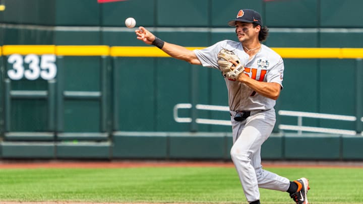 Jun 17, 2025; Omaha, Neb, USA; Oregon State Beavers second baseman AJ Singer (7) throws to first for an out to end the fifth inning against the Louisville Cardinals at Charles Schwab Field. Mandatory Credit: Dylan Widger-Imagn Images Jun 17, 2025; Omaha, Neb, USA; Oregon State Beavers second baseman AJ Singer (7) throws to first for an out to end the fifth inning against the Louisville Cardinals at Charles Schwab Field. Mandatory Credit: Dylan Widger-Imagn Images
